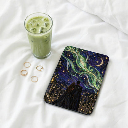 Book cover with couple looking at starry sky over city, near glass of matcha.