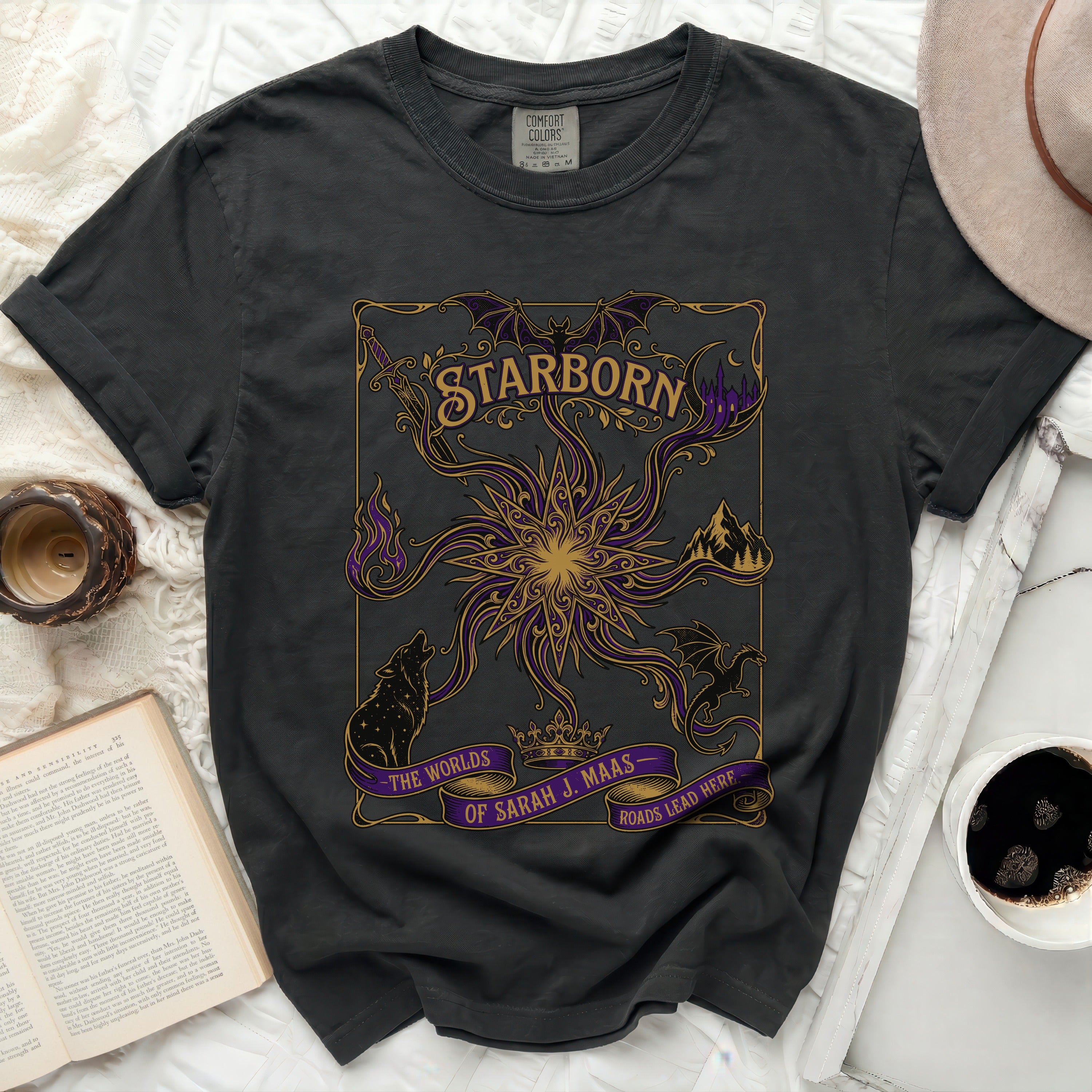 Black t-shirt with purple Starborn graphic and text.