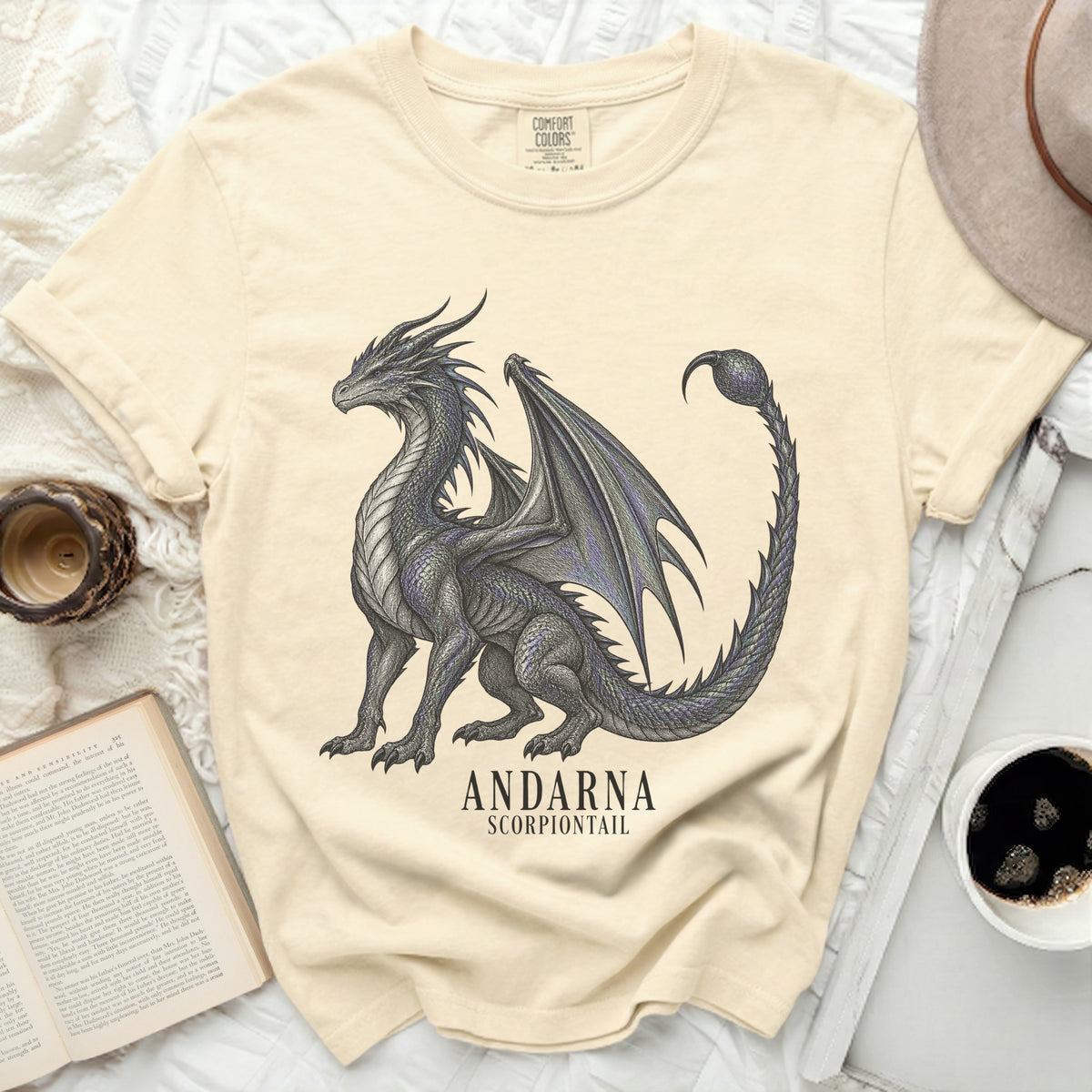 Cream t-shirt with a black dragon graphic and text "ANDARNA SCORPIONTAIL".