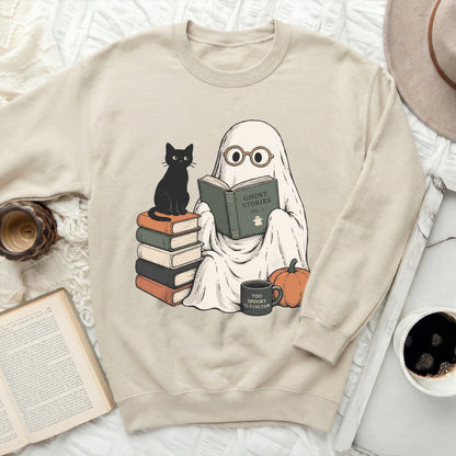 Ghost reading book with black cat, pumpkin, and mug.