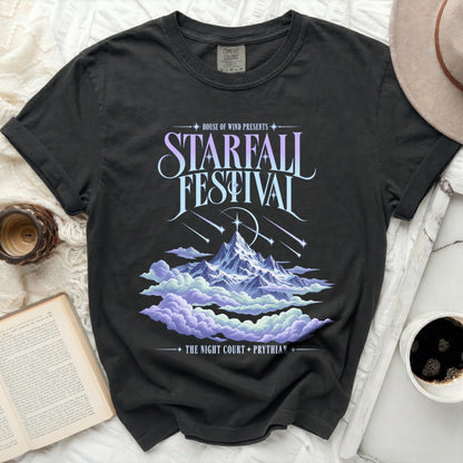 Black t-shirt with Starfall Festival graphic featuring mountains, clouds, and falling stars.