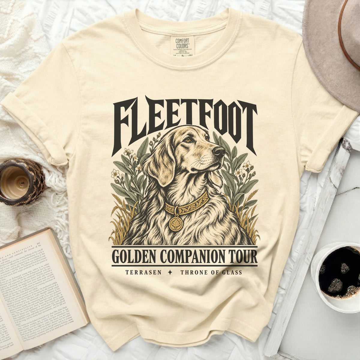 Light yellow t-shirt with Fleetfoot Golden Companion Tour graphic featuring a dog.