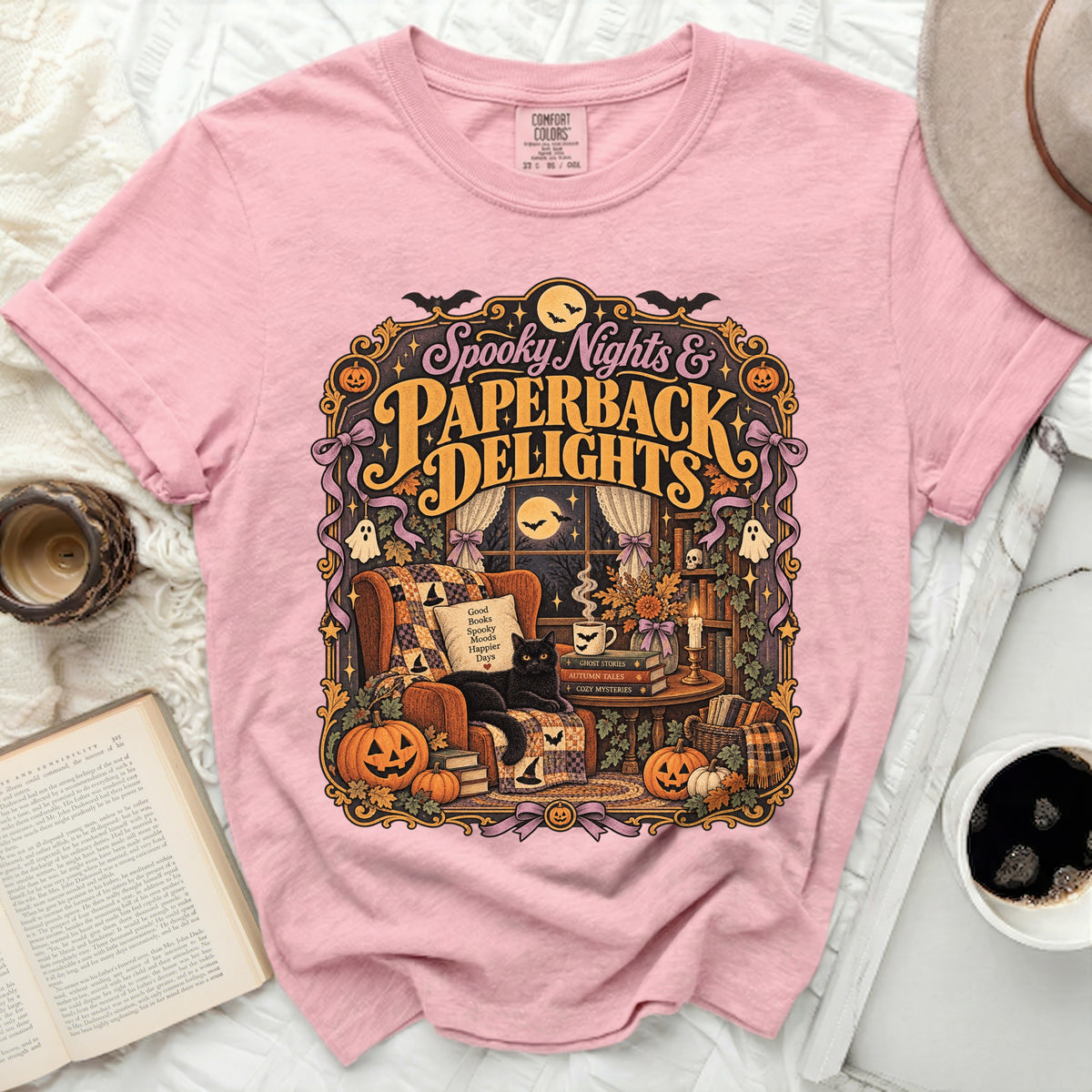 Pink t-shirt with "Spooky Nights & Paperback Delights" Halloween graphic.