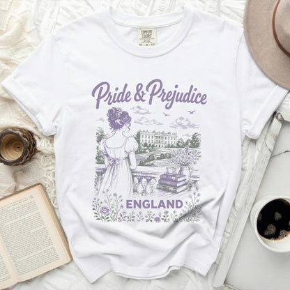 White t-shirt with "Pride & Prejudice ENGLAND" graphic and a woman looking at a manor.