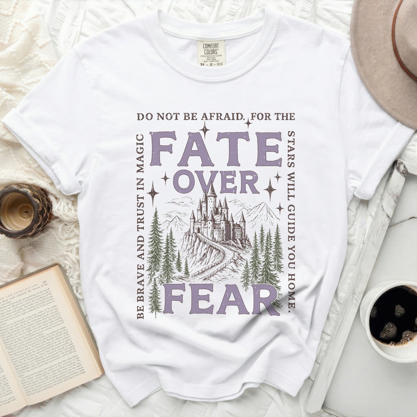 White Comfort Colors t-shirt with "Fate Over Fear" and castle graphic.
