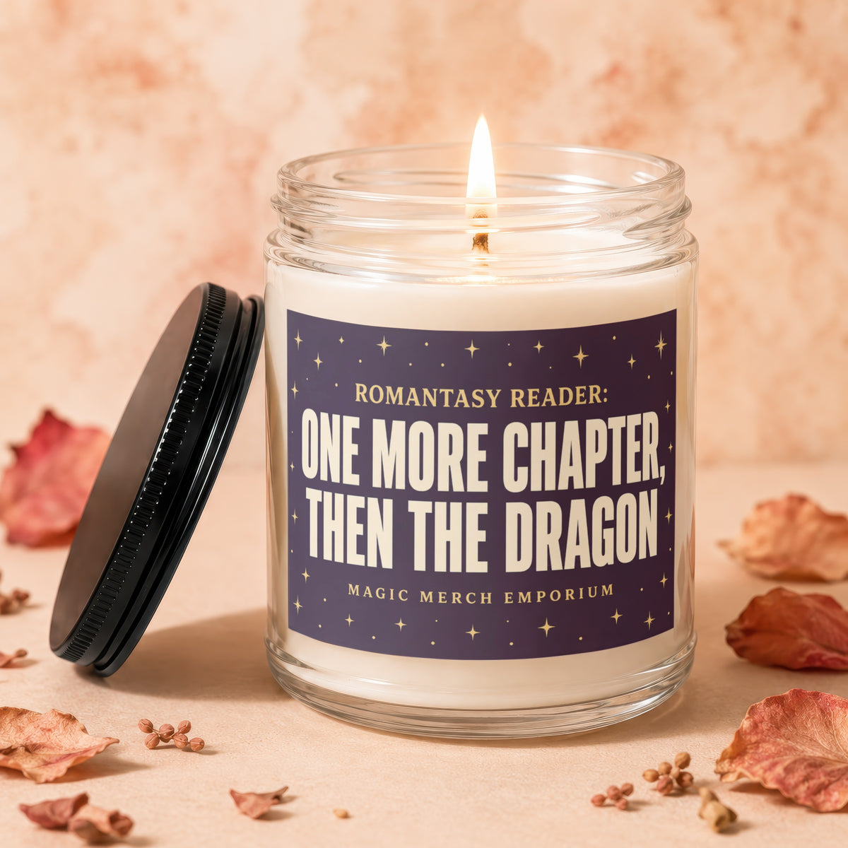 Candle with label "One More Chapter, Then The Dragon" and lit wick.