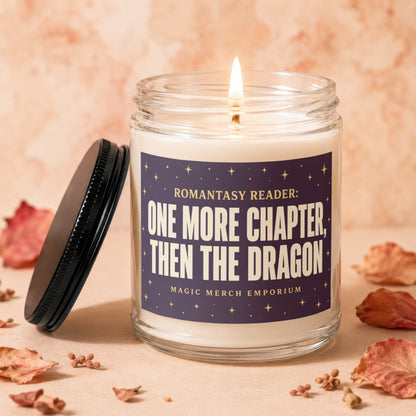 Candle with label "One More Chapter, Then The Dragon" and lit wick.