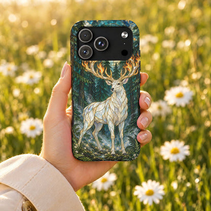 A hand holding a smartphone with a mosaic-style deer in a forest design.