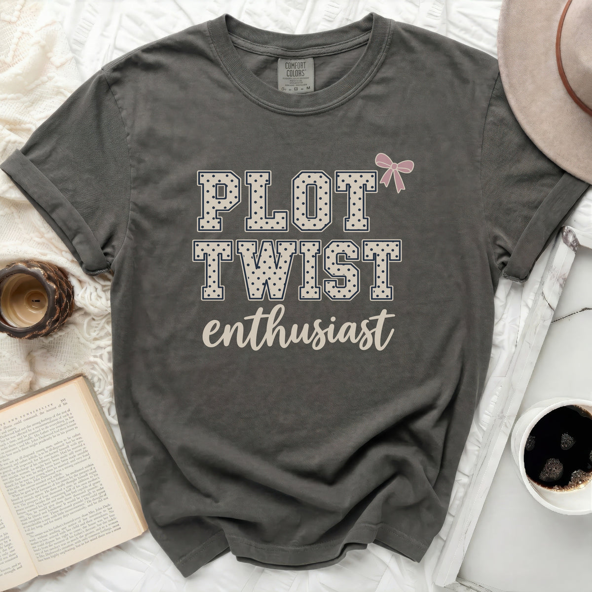 Gray t-shirt with "PLOT TWIST enthusiast" and a pink bow graphic.