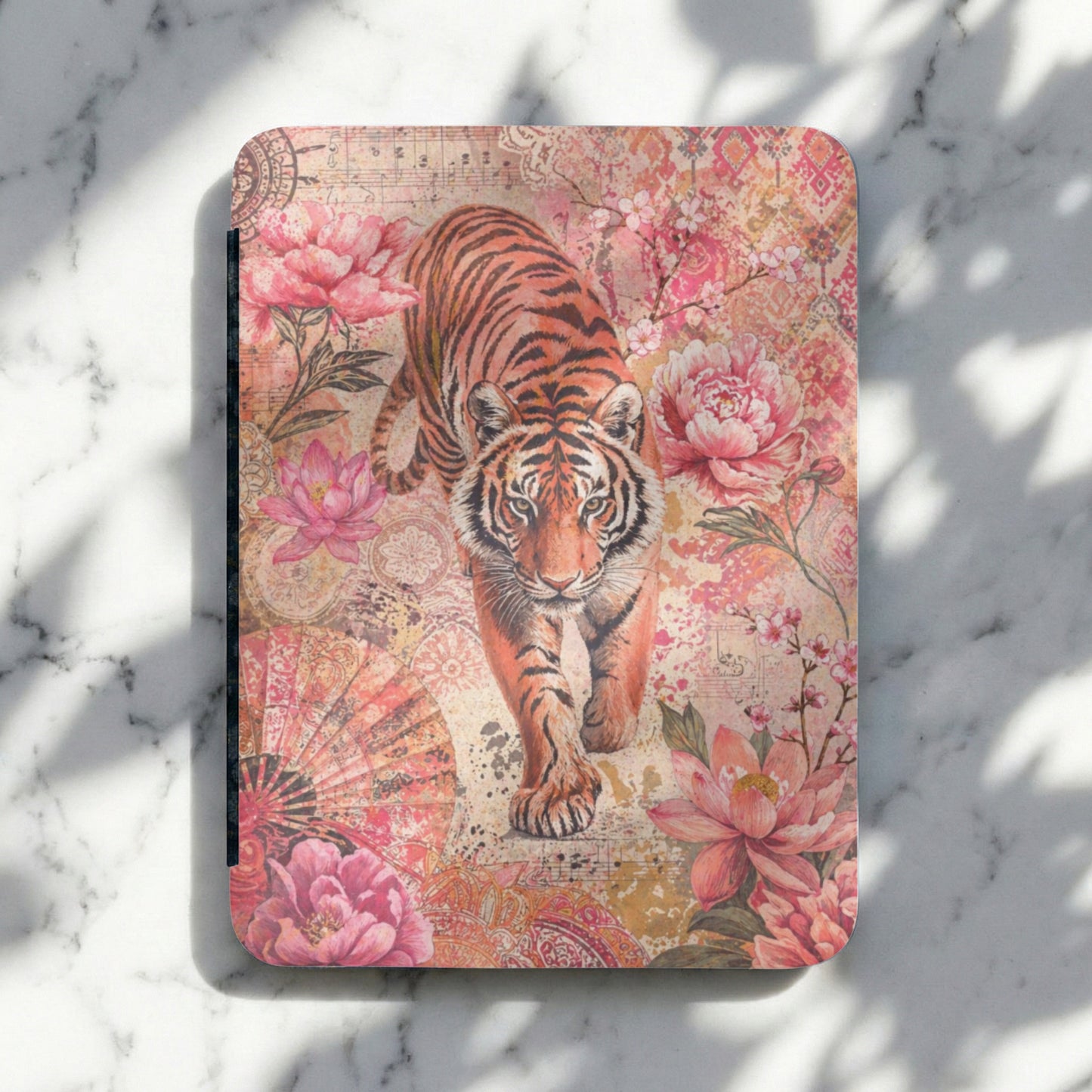 Notebook cover with a tiger walking through floral patterns and musical notes.