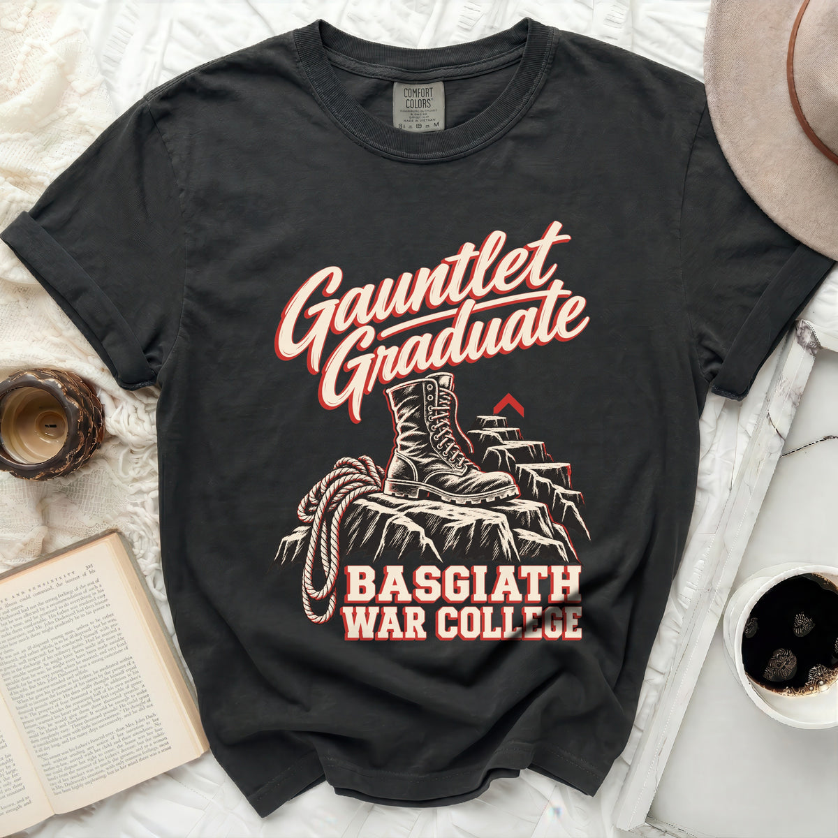 Black t-shirt with "Gauntlet Graduate Basgiath War College" text and boot graphic.