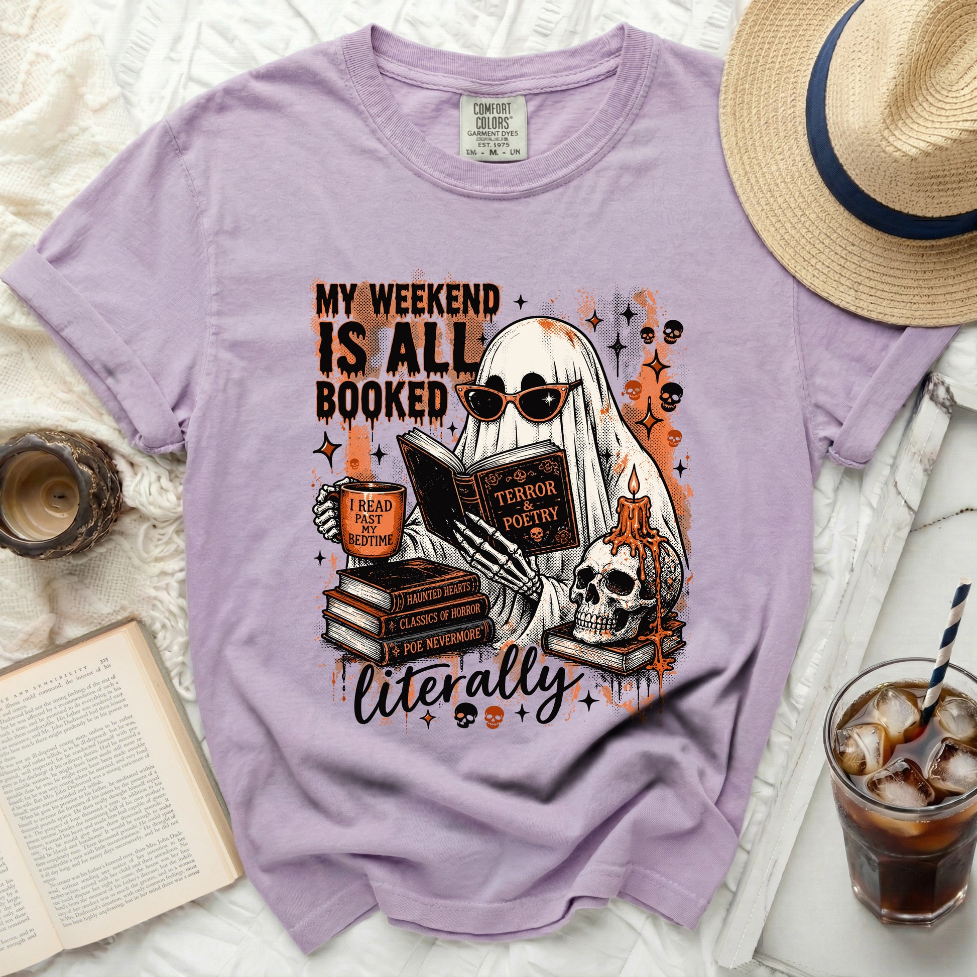 Lavender t-shirt with a Halloween-themed graphic of a ghost reading, "My weekend is all booked."