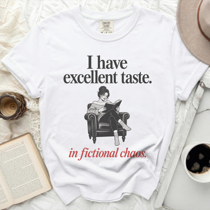 White t-shirt with "I have excellent taste. in fictional chaos." text.