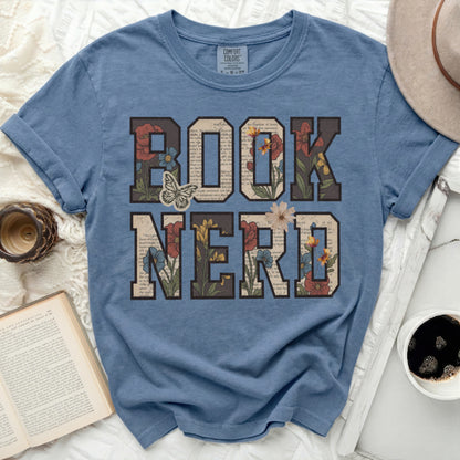 Blue t-shirt with "BOOK NERD" in floral letter art.