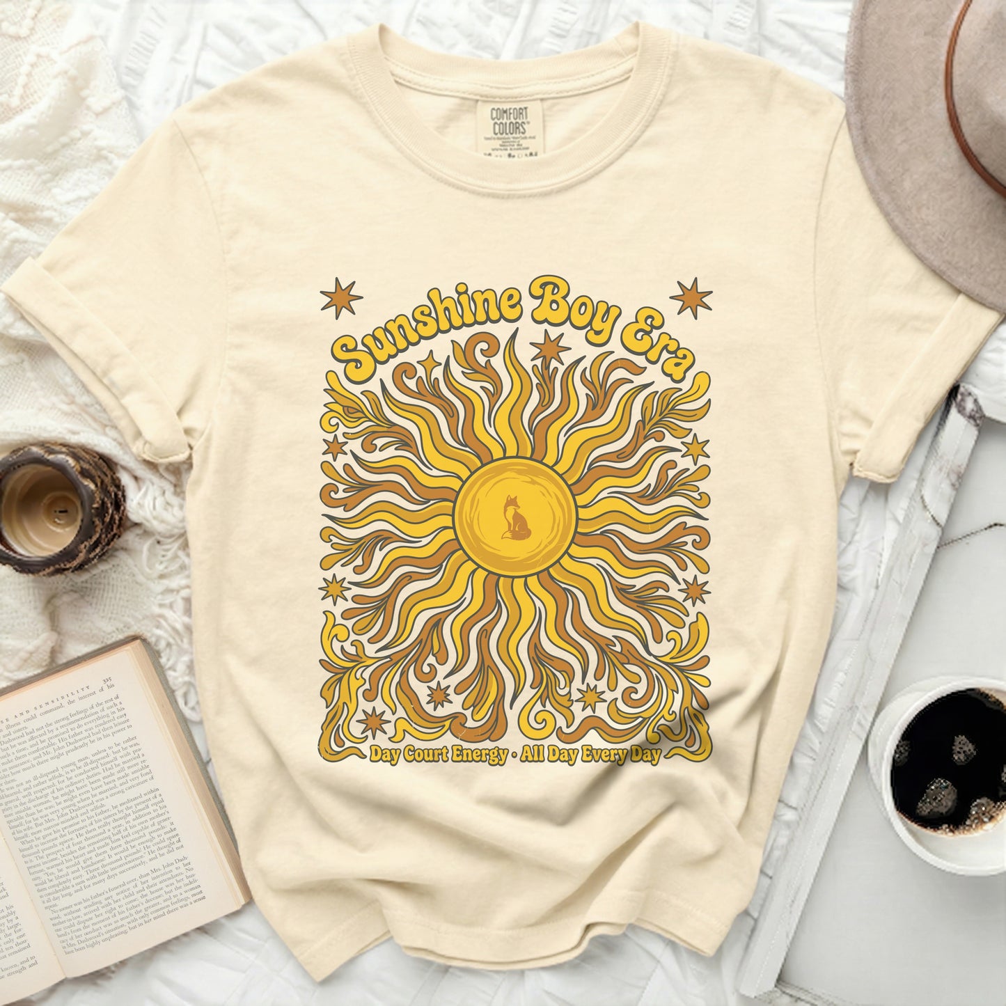 Cream t-shirt with "Sunshine Boy Era" and sun graphic.
