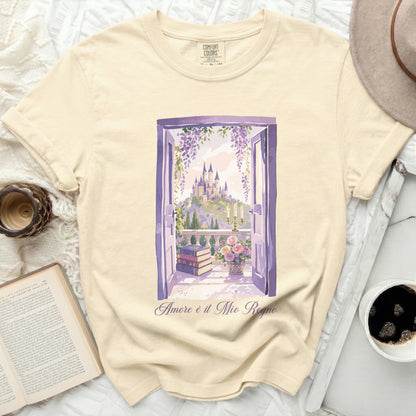 Cream t-shirt with watercolor print of castle through open window and text "Amore è il Mio Regno".
