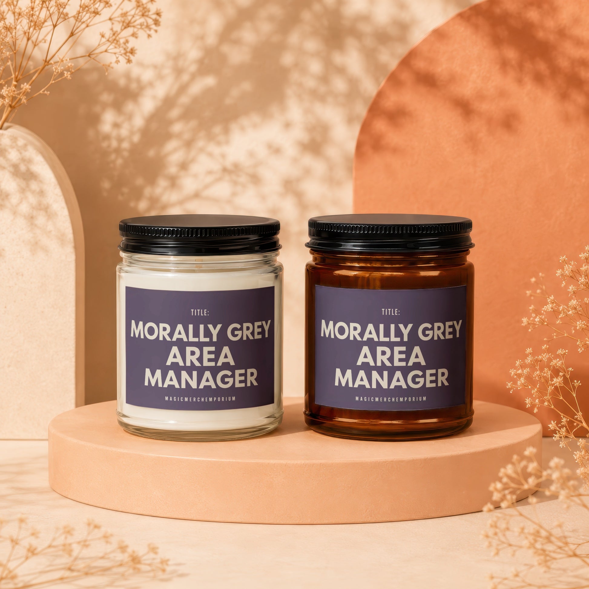 Two candles, one clear and one amber, with "Morally Grey Area Manager" labels.