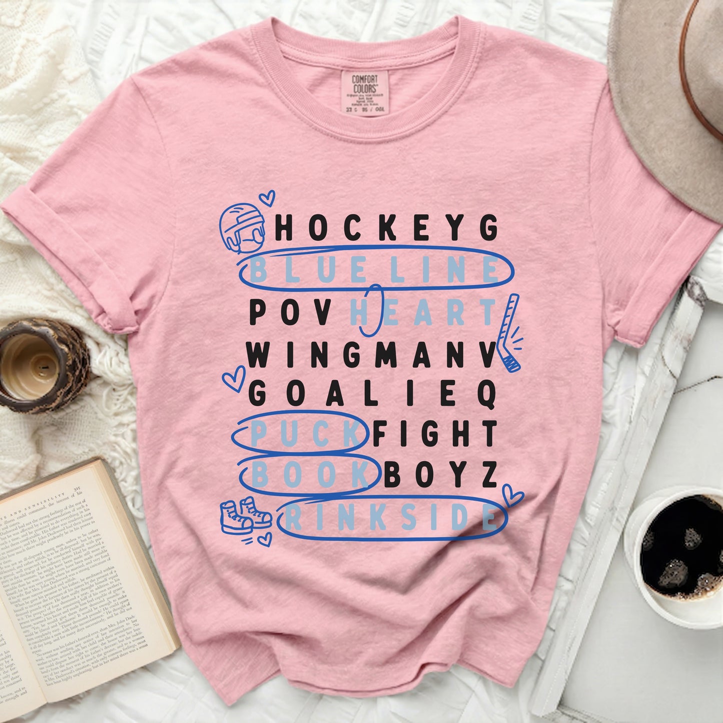 Pink t-shirt with "Hockey" themed word art in blue and white.