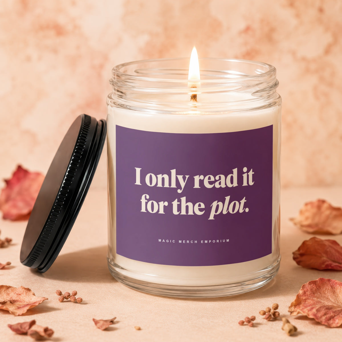 Candle with purple label reading "I only read it for the plot."