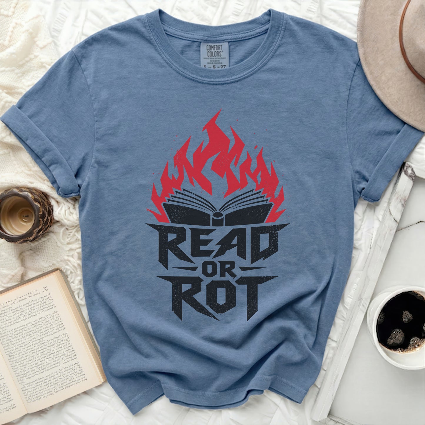 Blue t-shirt with "Read or Rot" text and flaming open book design.