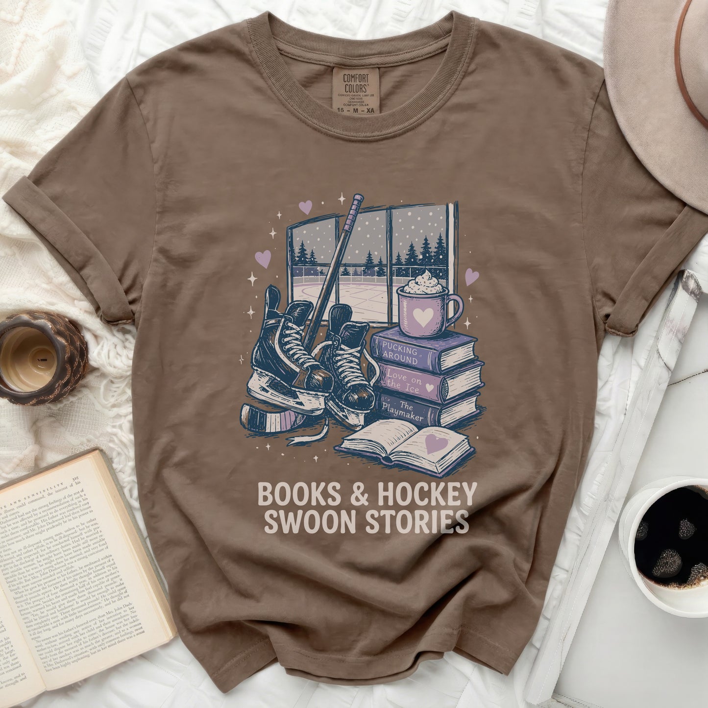 Brown t-shirt with "Books & Hockey Swoon Stories" graphic.