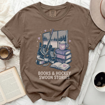 Brown t-shirt with "Books & Hockey Swoon Stories" graphic.