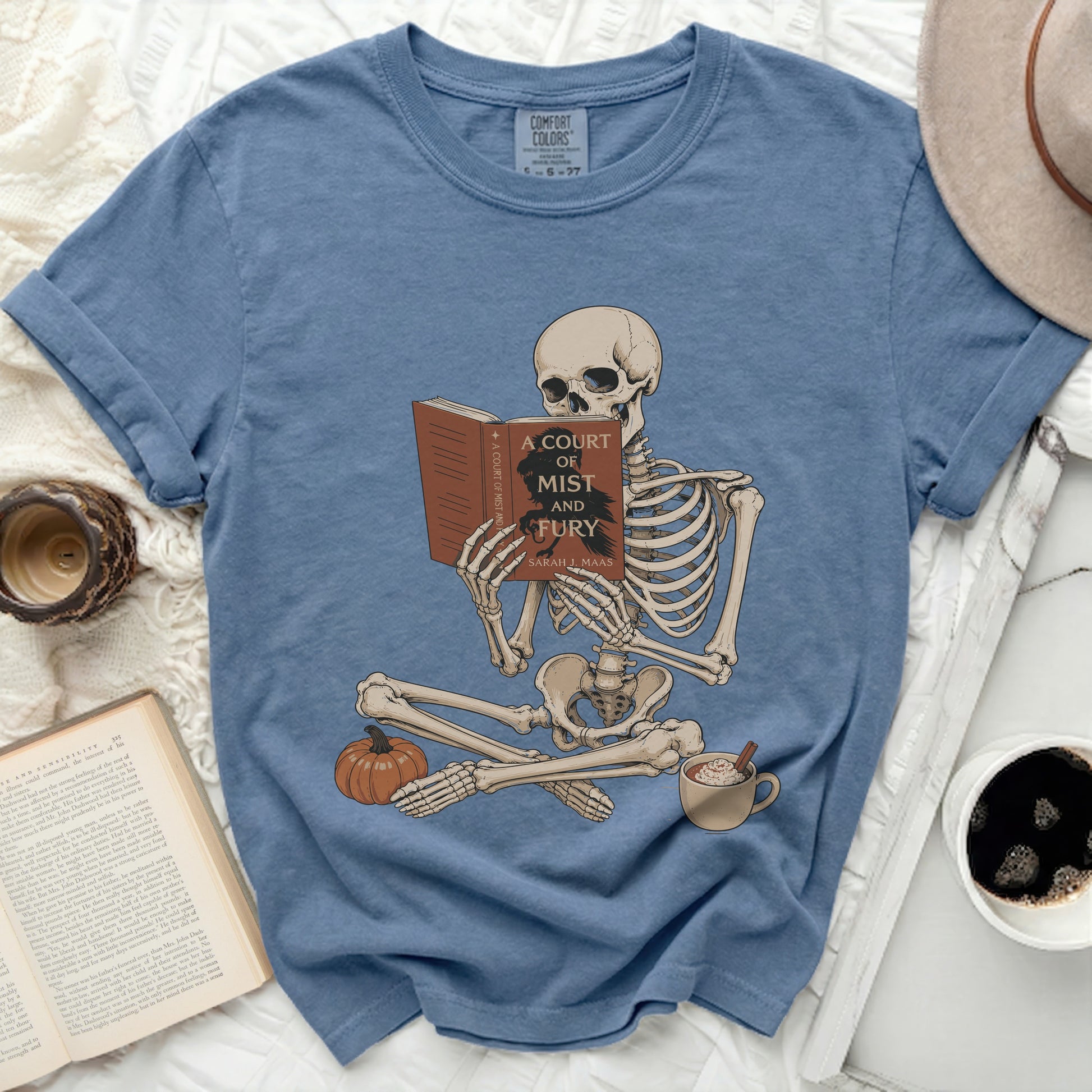 Skeleton reads "A Court of Mist and Fury" by Sarah J. Maas.