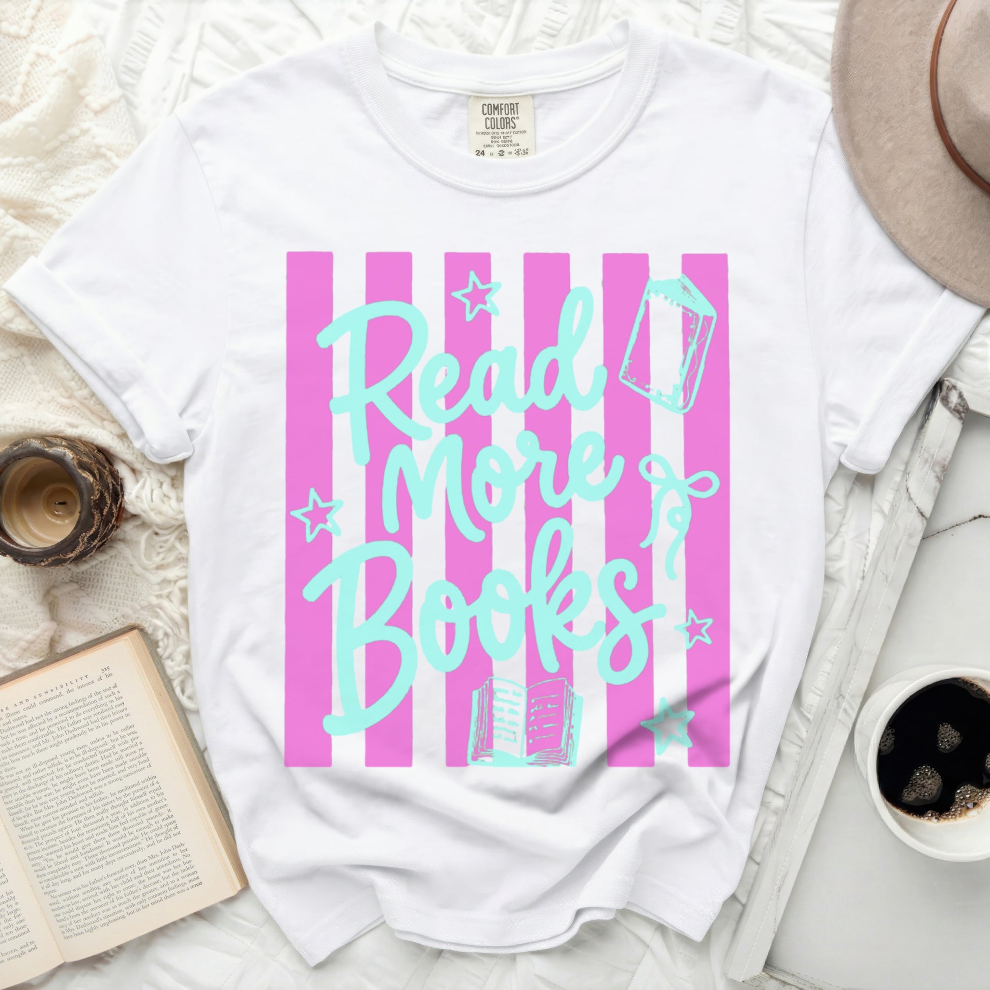 White t-shirt with pink and blue stripes and "Read More Books" graphic.
