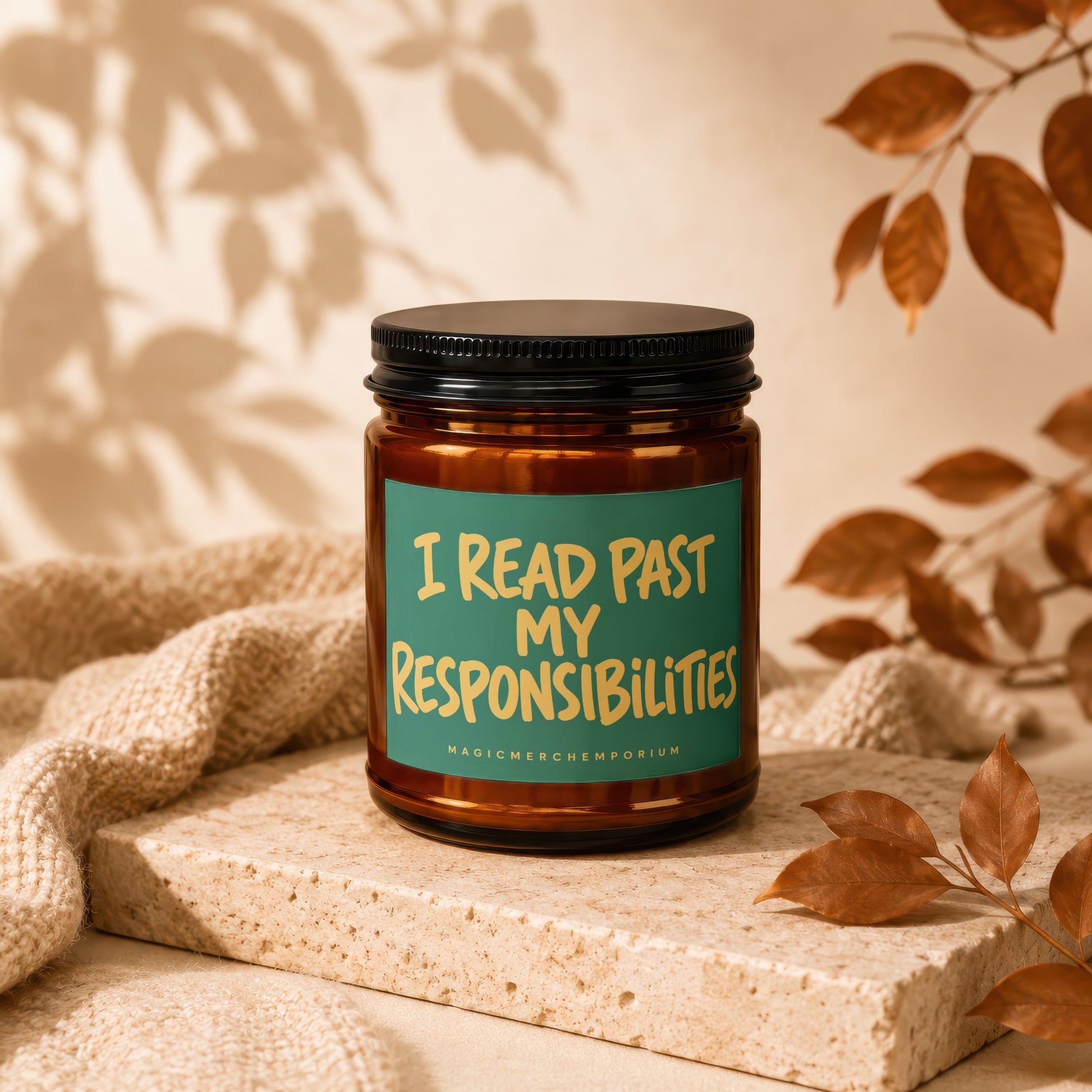 Amber jar candle with "I READ PAST MY RESPONSIBILITIES" text on a teal label.