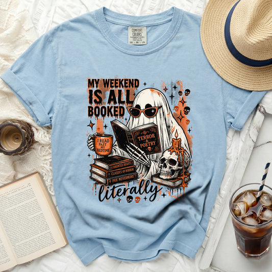 Ghost reading books with text "My Weekend Is All Booked" and a skull.