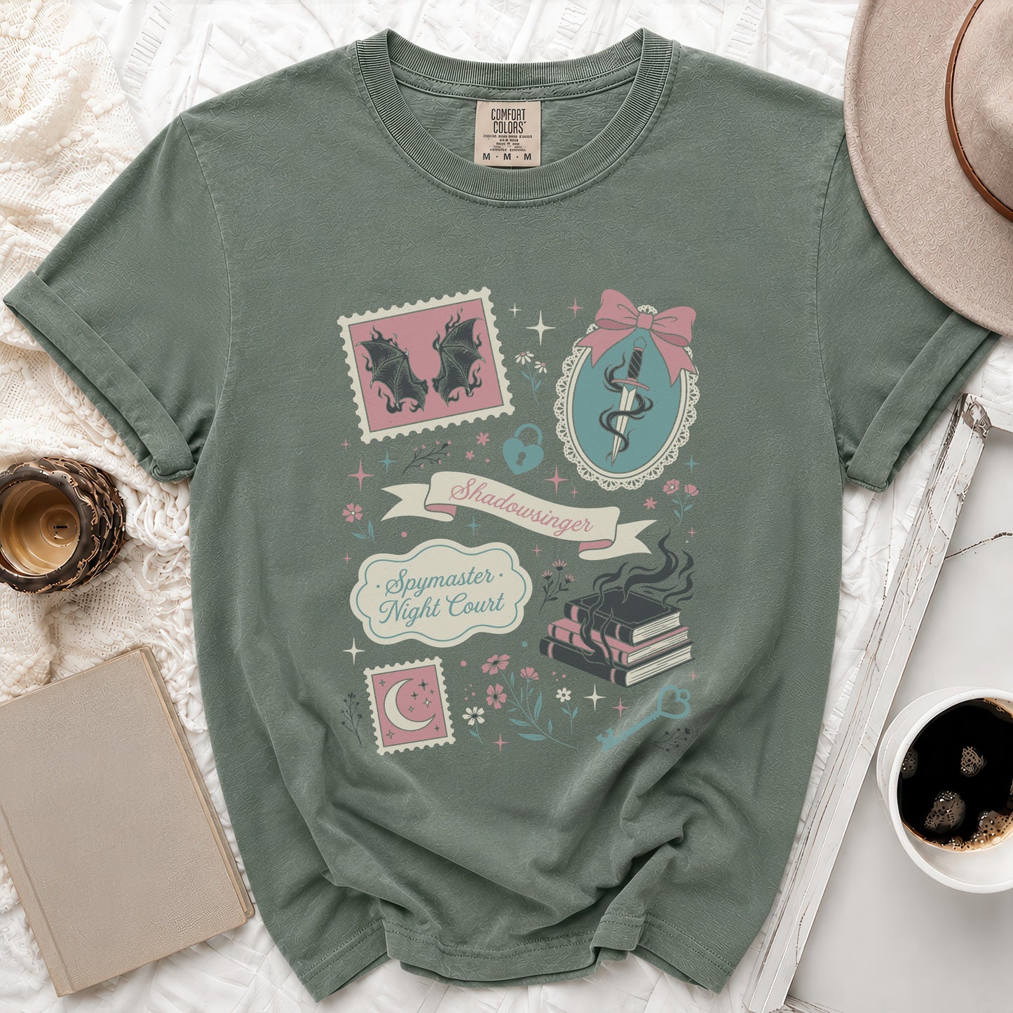 Sage green t-shirt with "Shadowsinger Spymaster Night Court" text and mystical graphics.