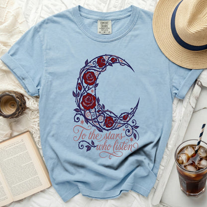 Light blue t-shirt with crescent moon and roses design and text "To the stars who listen".