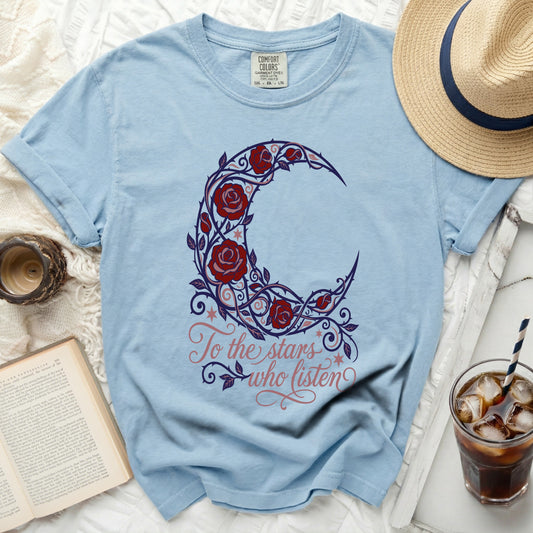 Light blue t-shirt with crescent moon and roses design and text "To the stars who listen".