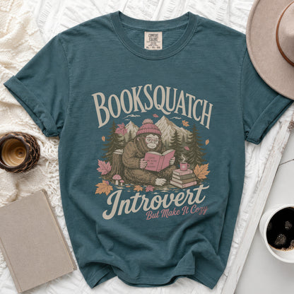 Teal t-shirt with Bigfoot reading, "Booksquatch Introvert But Make It Cozy" text.