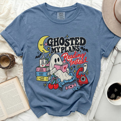 Blue t-shirt with "Ghosted My Plans, Reading Instead" graphic featuring a ghost reading.