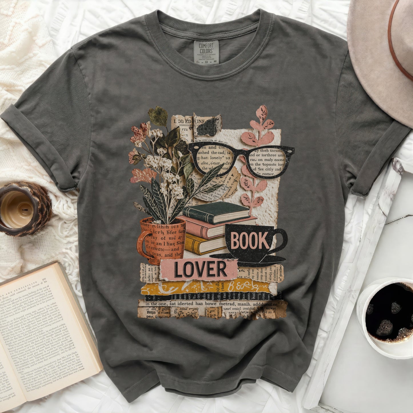 Dark t-shirt with "Book Lover" text, glasses, and plant illustration.
