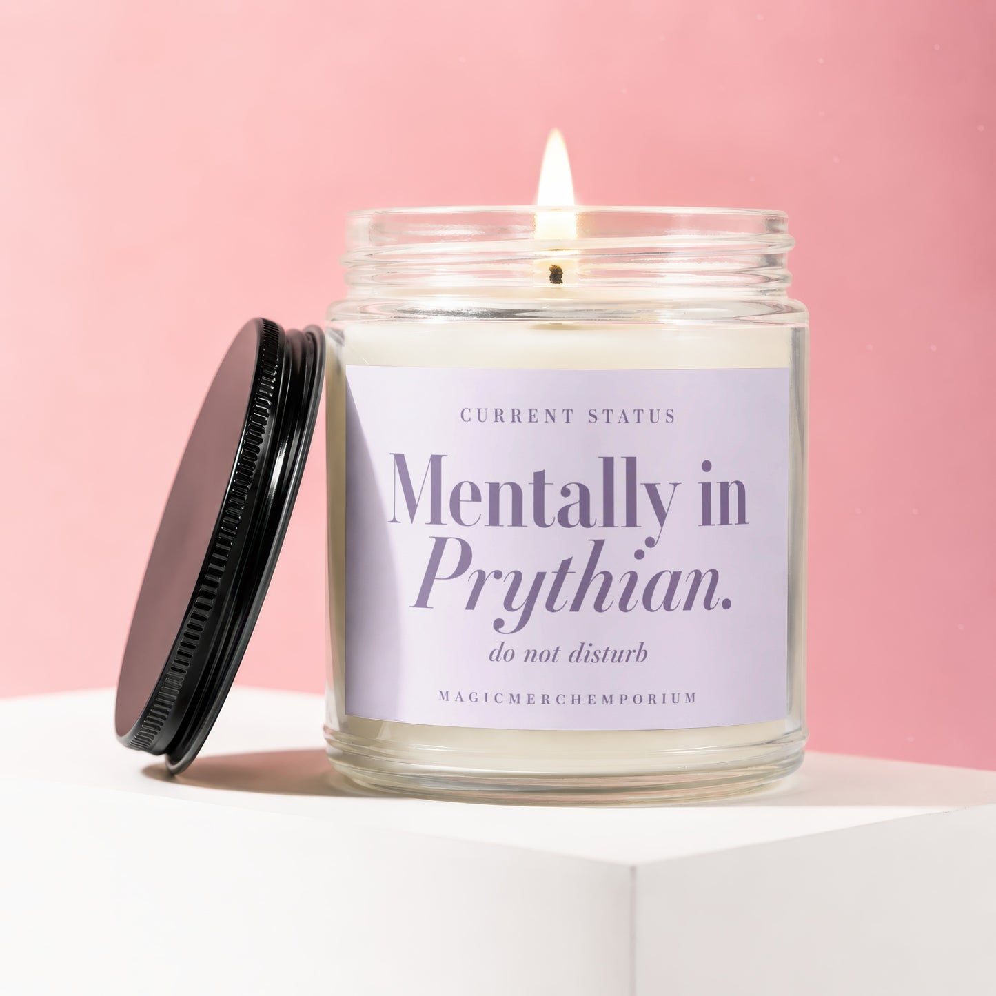 Lit candle in a jar with black lid, reading "Mentally in Prythian. do not disturb".