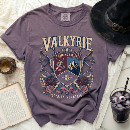 Purple t-shirt with Valkyrie Training Society and Illyrian Mountains graphic.