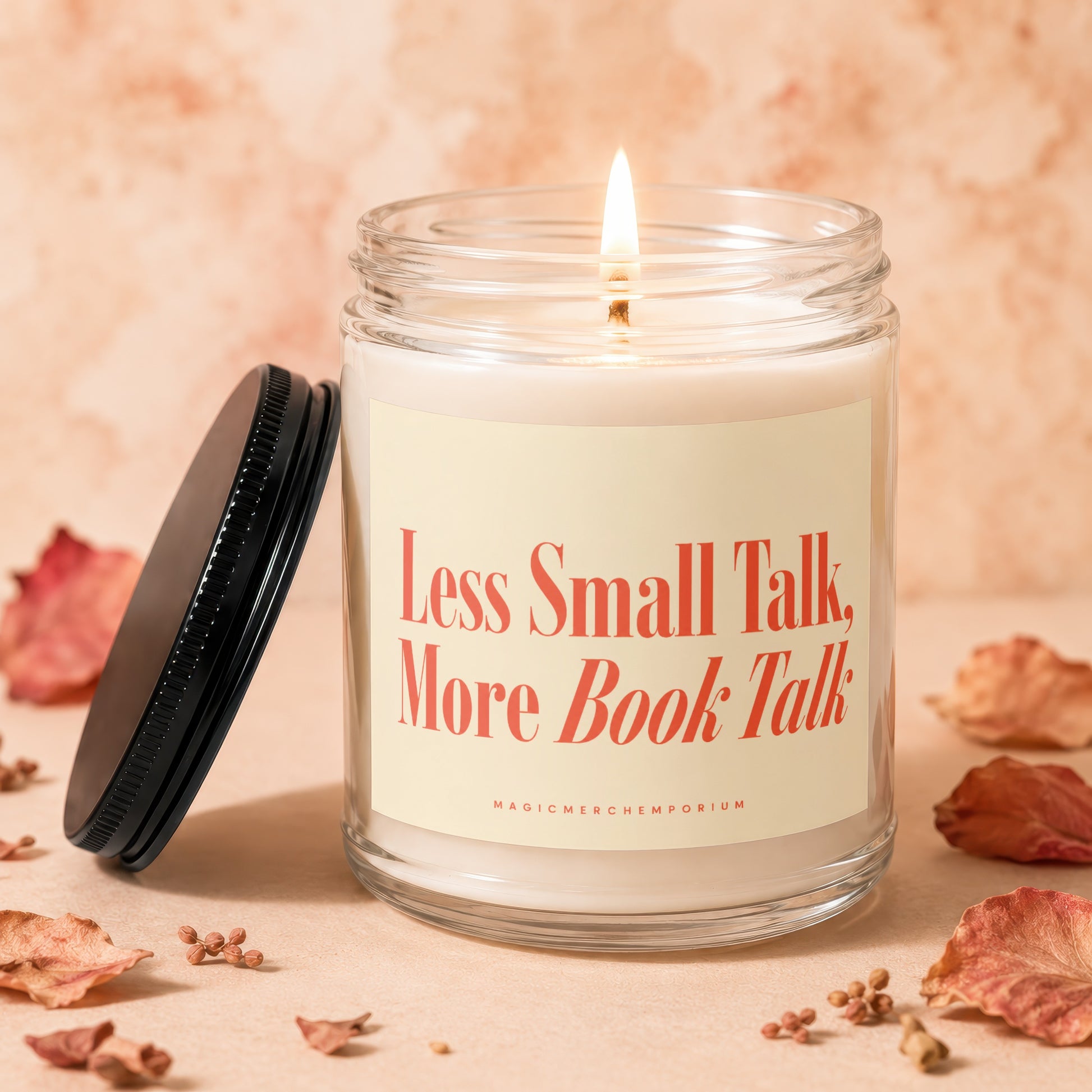 Burning candle in glass jar with "Less Small Talk, More Book Talk" text.