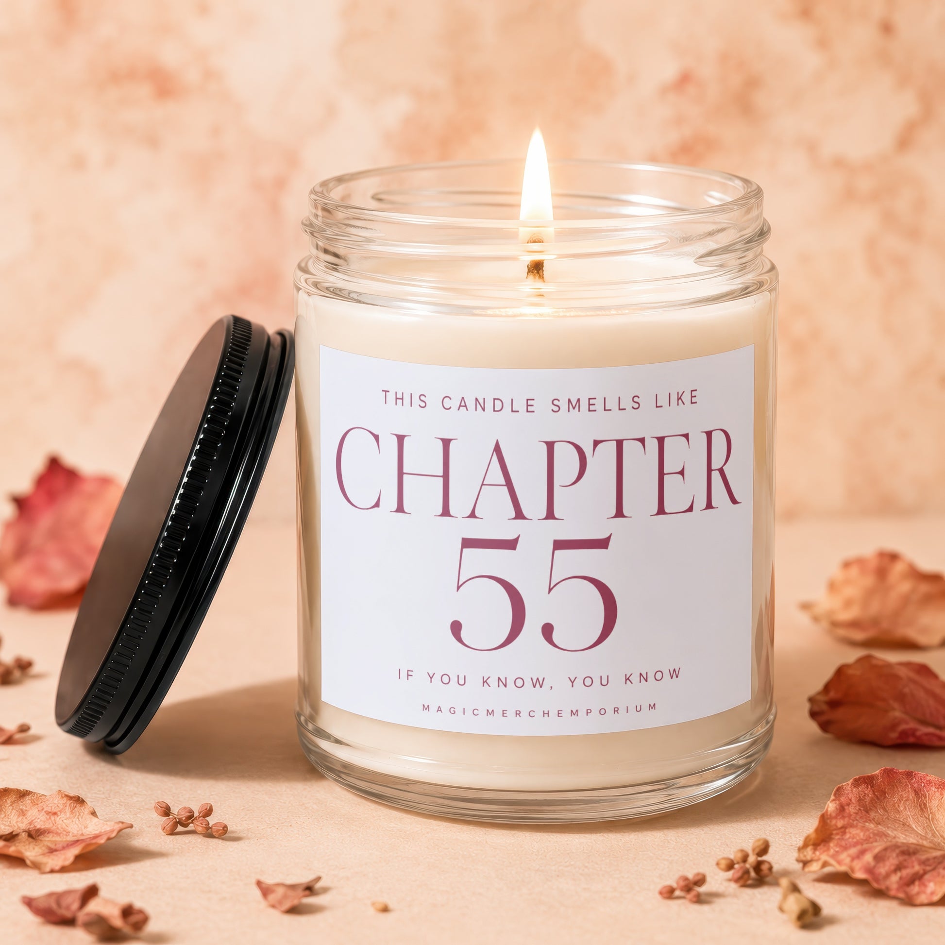Burning candle in glass jar labeled Chapter 55, MagicMerchEmporium.