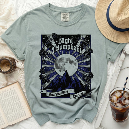 Light blue t-shirt with "Night Triumphant And The Stars Eternal" moon and mountain graphic.