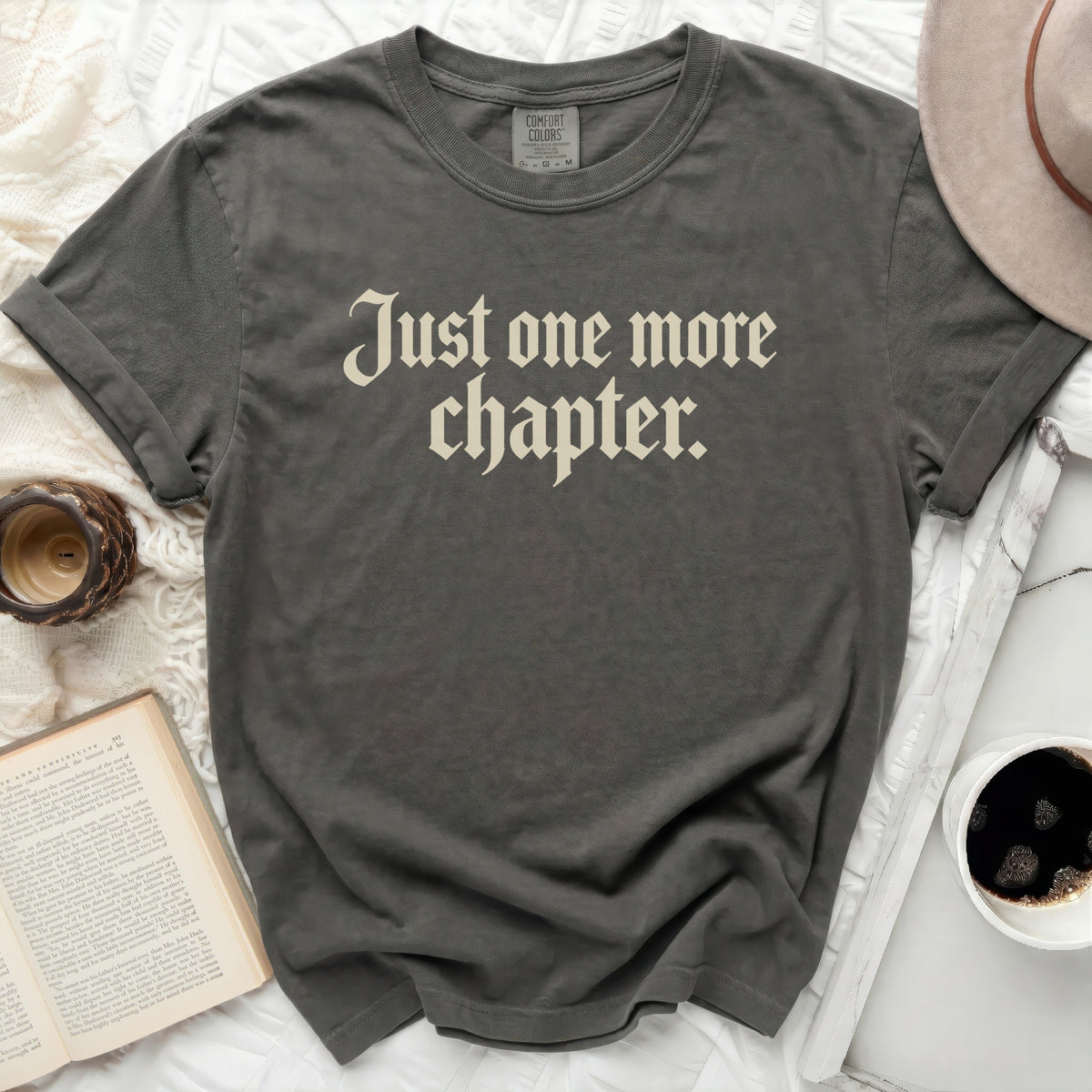 Charcoal t-shirt with "Just one more chapter." text.