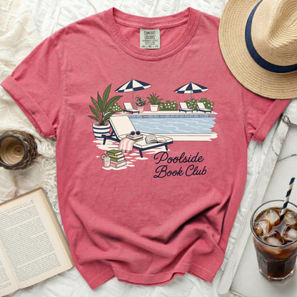 T-shirt with "Poolside Book Club" graphic featuring a pool and lounge chairs.