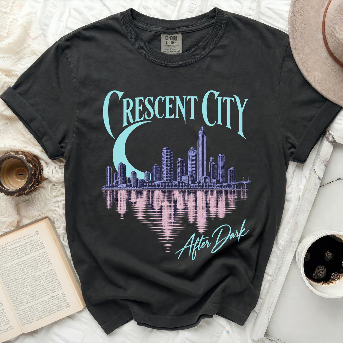 Black t-shirt with "Crescent City After Dark" text and skyline graphic.