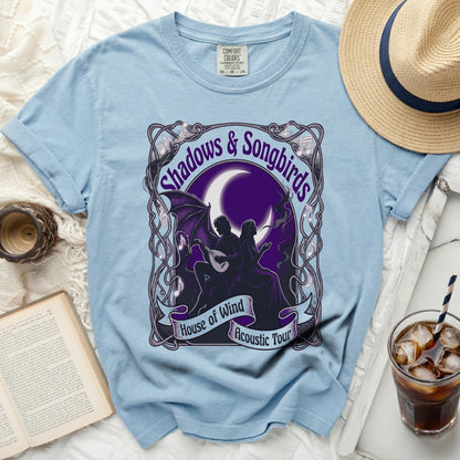 Light blue t-shirt with "Shadows & Songbirds House of Wind Acoustic Tour" graphic.