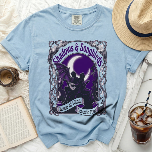 Light blue t-shirt with "Shadows & Songbirds House of Wind Acoustic Tour" graphic.