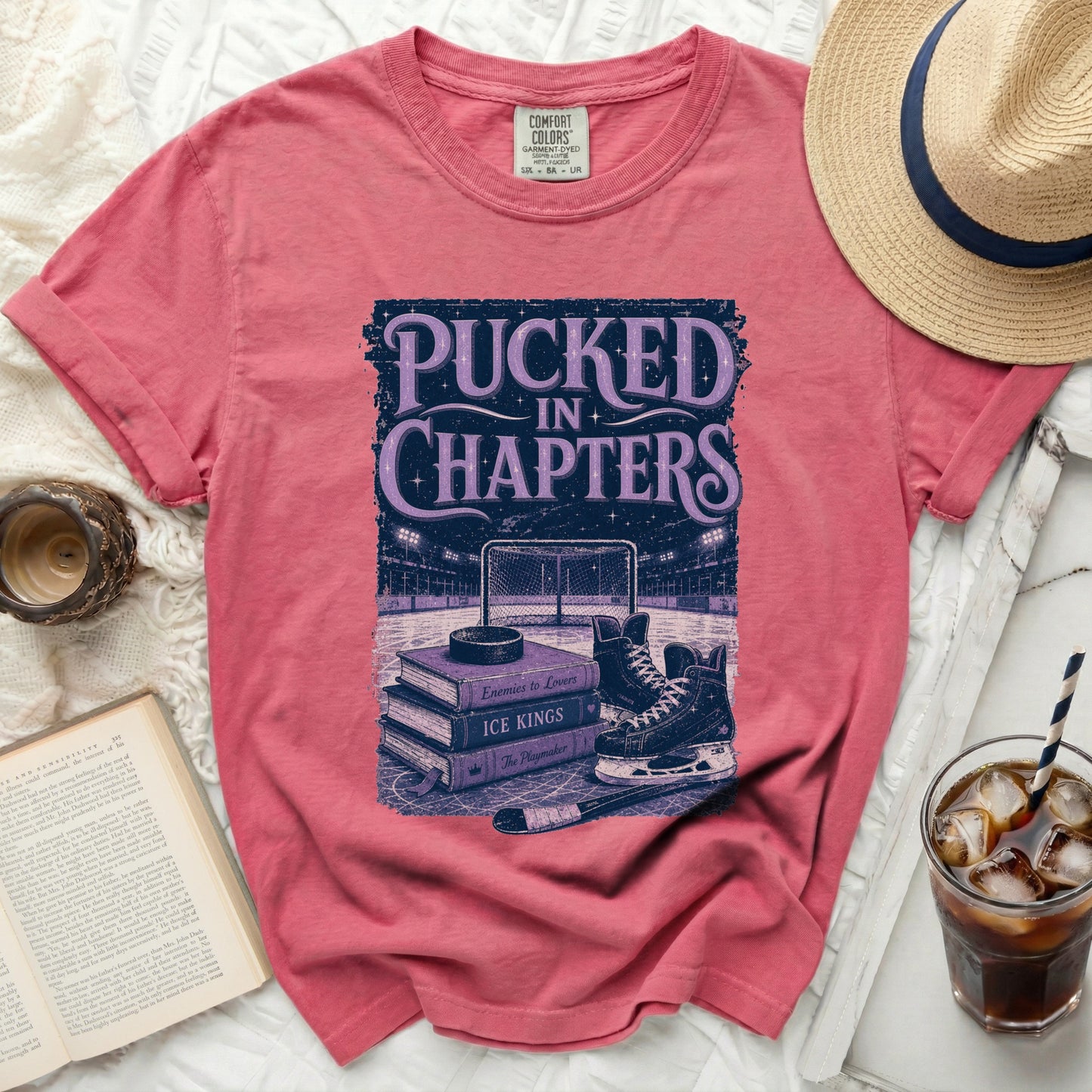 T-shirt with "Pucked in Chapters" text and hockey imagery.