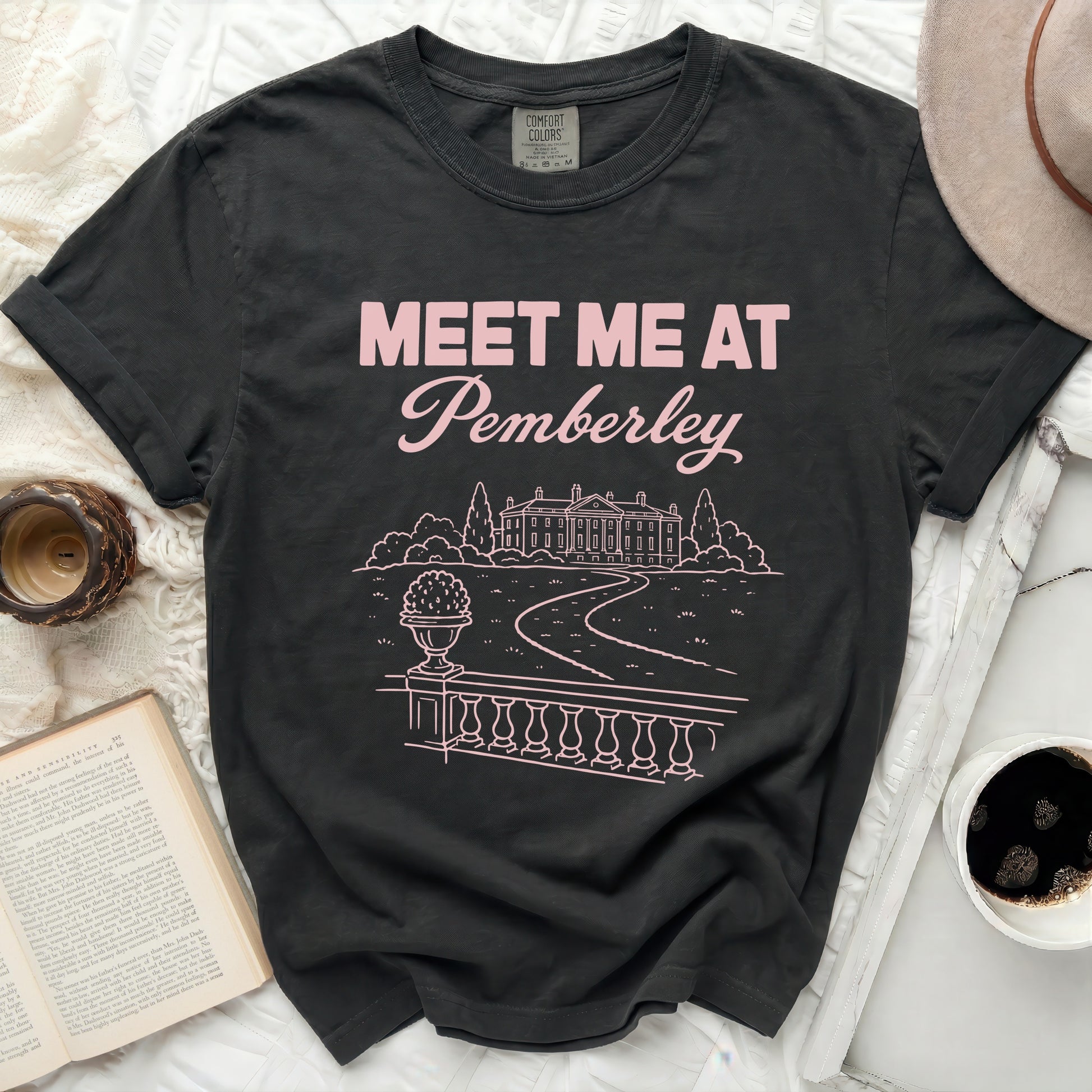 T-shirt with "Meet Me at Pemberley" text and line drawing of a mansion.