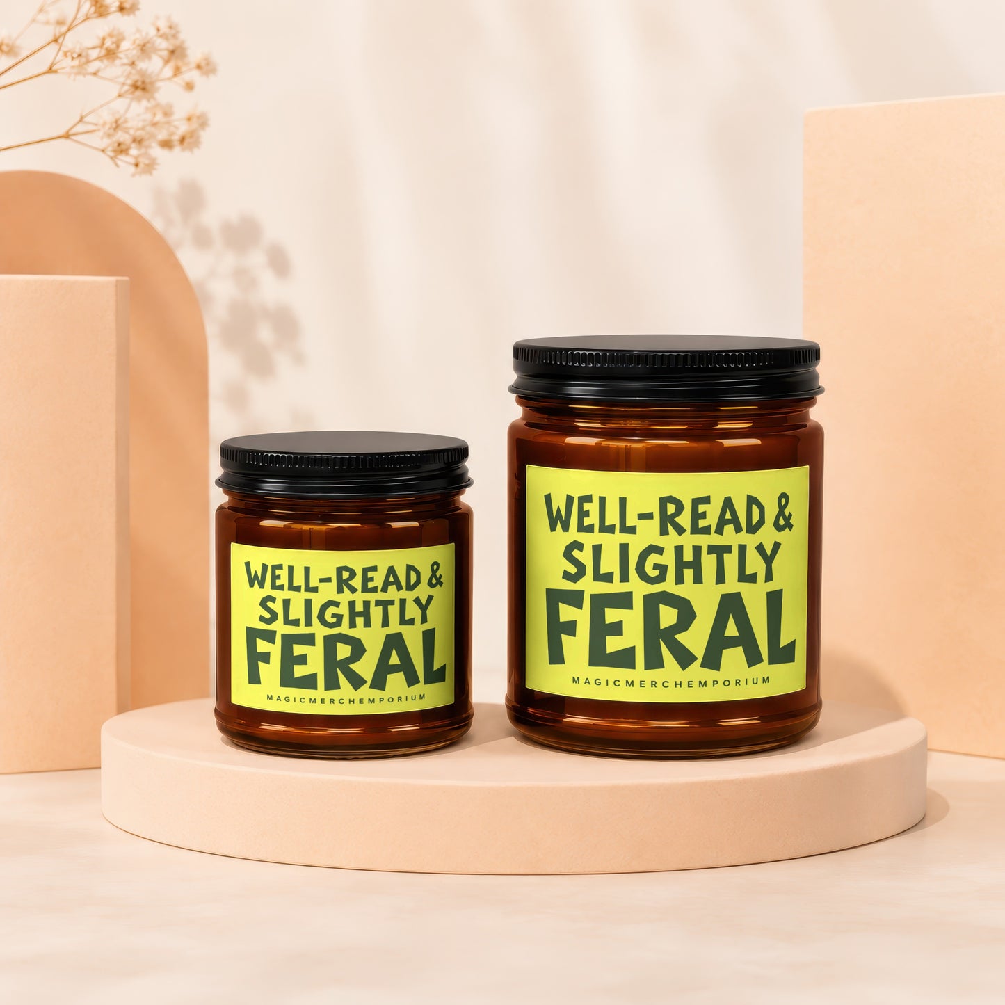 Two amber jars with black lids, one larger than the other, each with a "Well-Read & Slightly Feral" label.