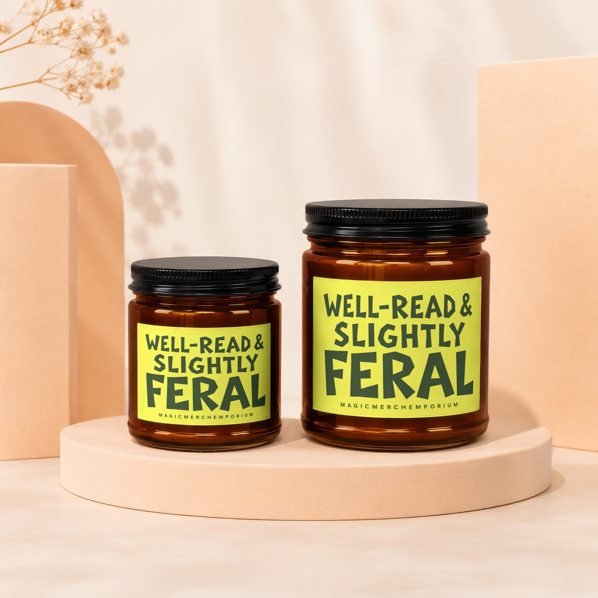 Two amber jars with black lids, one larger than the other, each with a "Well-Read & Slightly Feral" label.